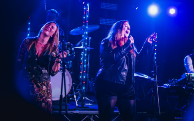 Interactive event entertainment with a live karaoke band